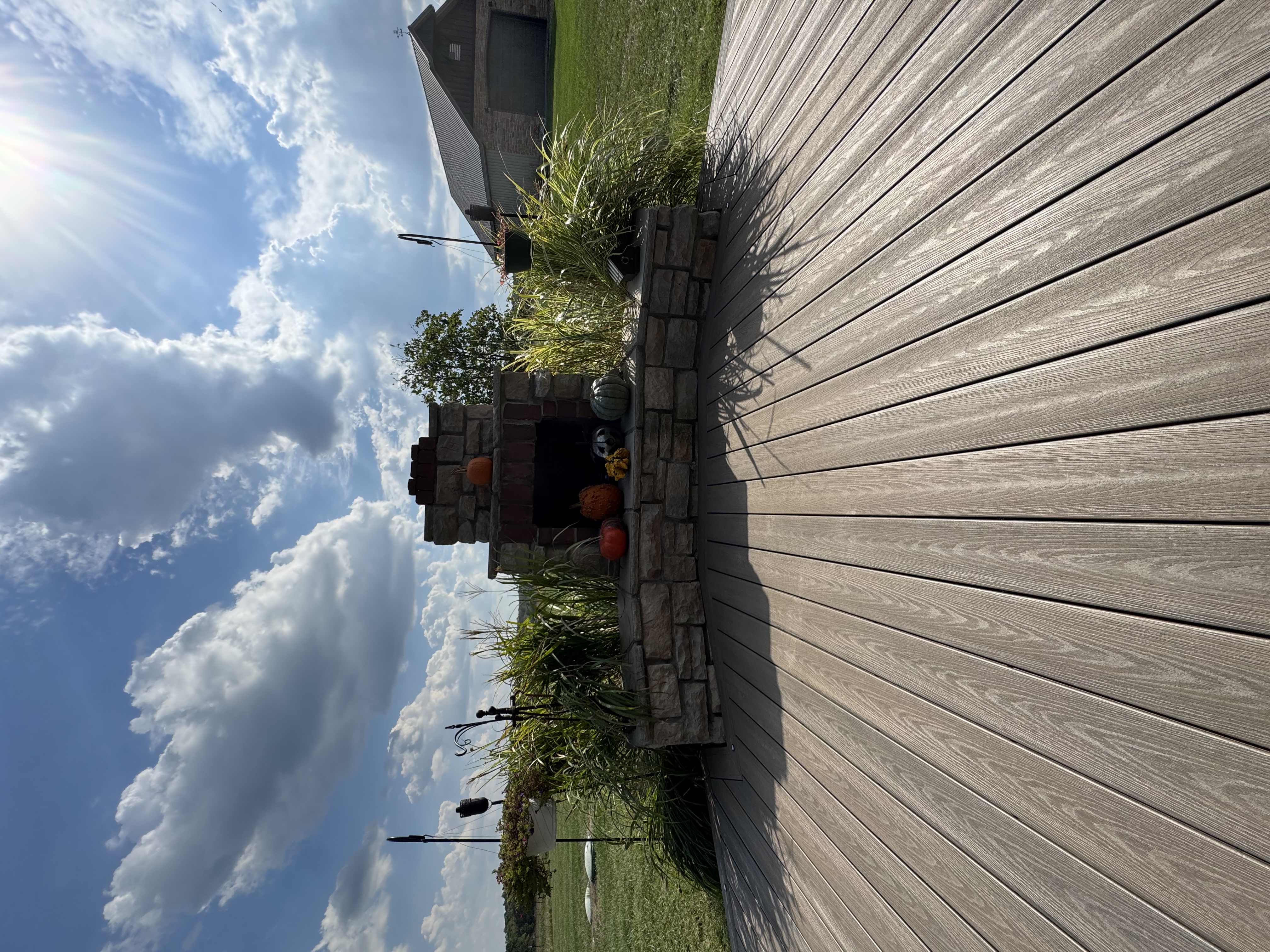 Outdoor Living Deck with Stone Fireplace